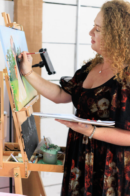 Katie painting live at a celebration